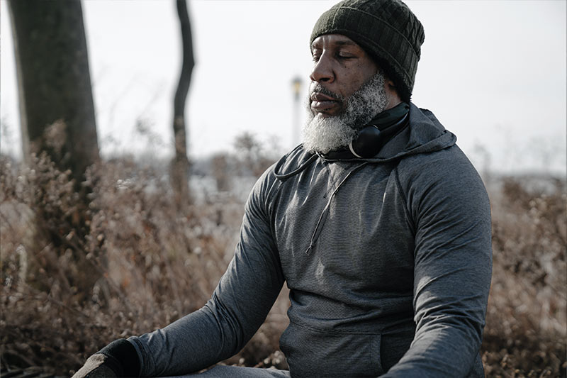 Man meditating outside
