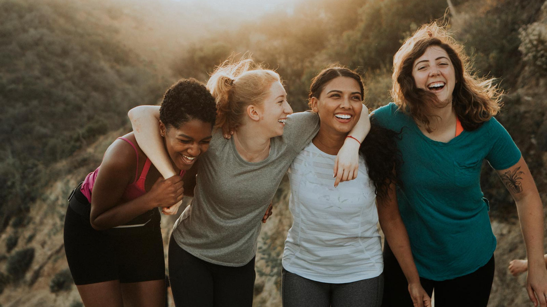 Group of women smiling and walking together