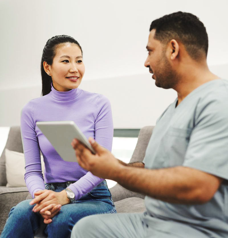 Woman talking with doctor
